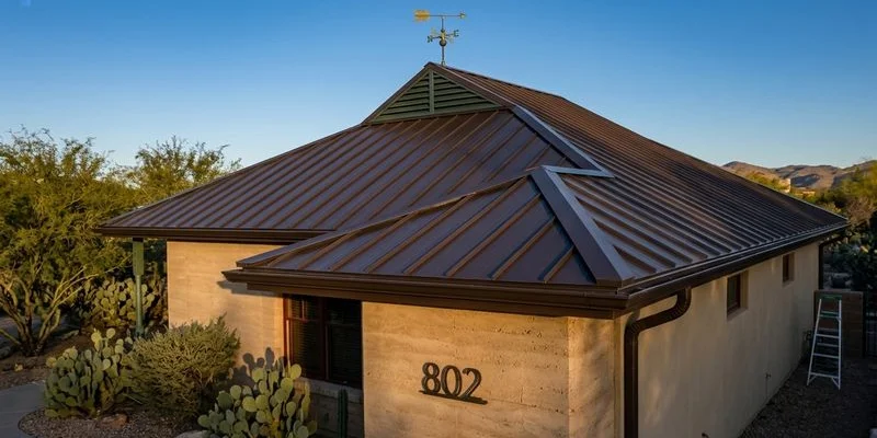 New roof installation completed on a Tucson home with clean finished appearance and desert landscaping