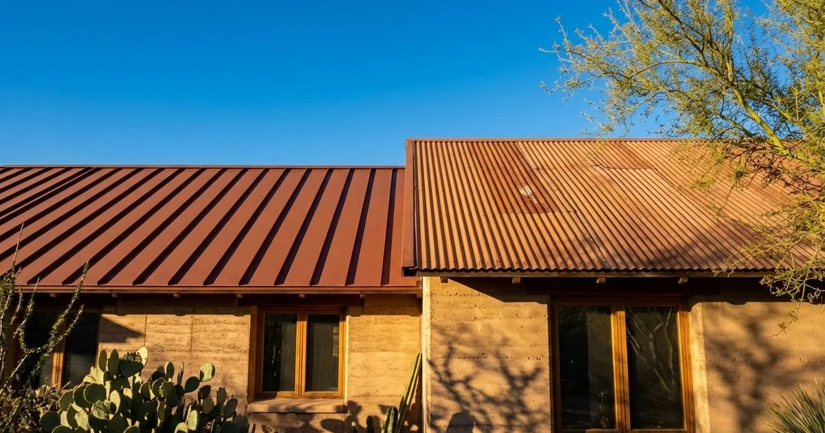 Side by side comparison of standing seam and corrugated metal roofing panels on Tucson homes